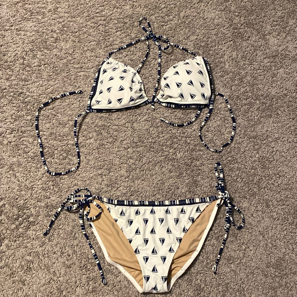 Lane Bryant string bikini with 2 sets of bottoms one high waisted one string.